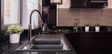 A kitchen sink with a faucet

Description automatically generated with medium confidence