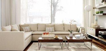 A living room with white couches Description automatically generated with medium confidence